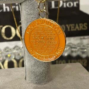 Auth Louis Vuitton orange trunks and bags Medallion charm pendant